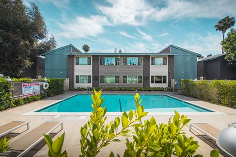 A modern house with a pool in the backyard.