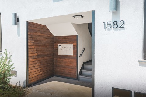 A white house with the number 1582 on the wall.