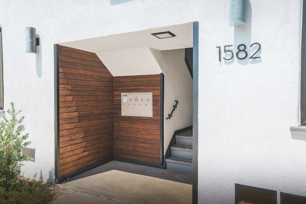 A white house with the number 1582 on the wall.