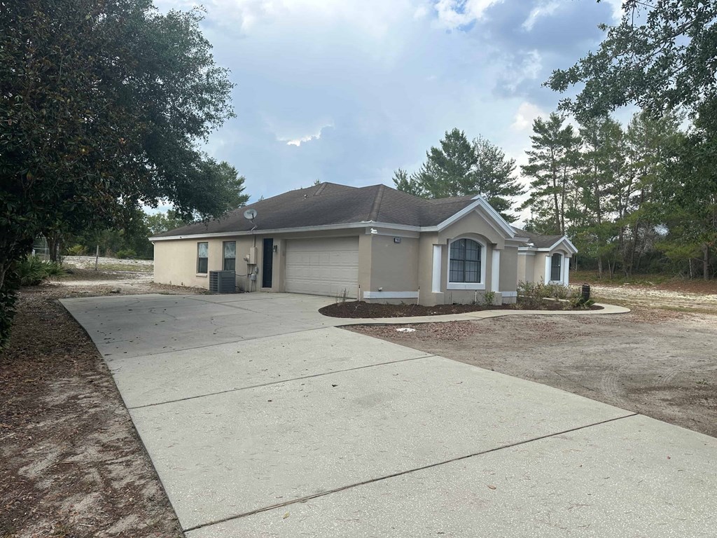 A house with a driveway in front of it.