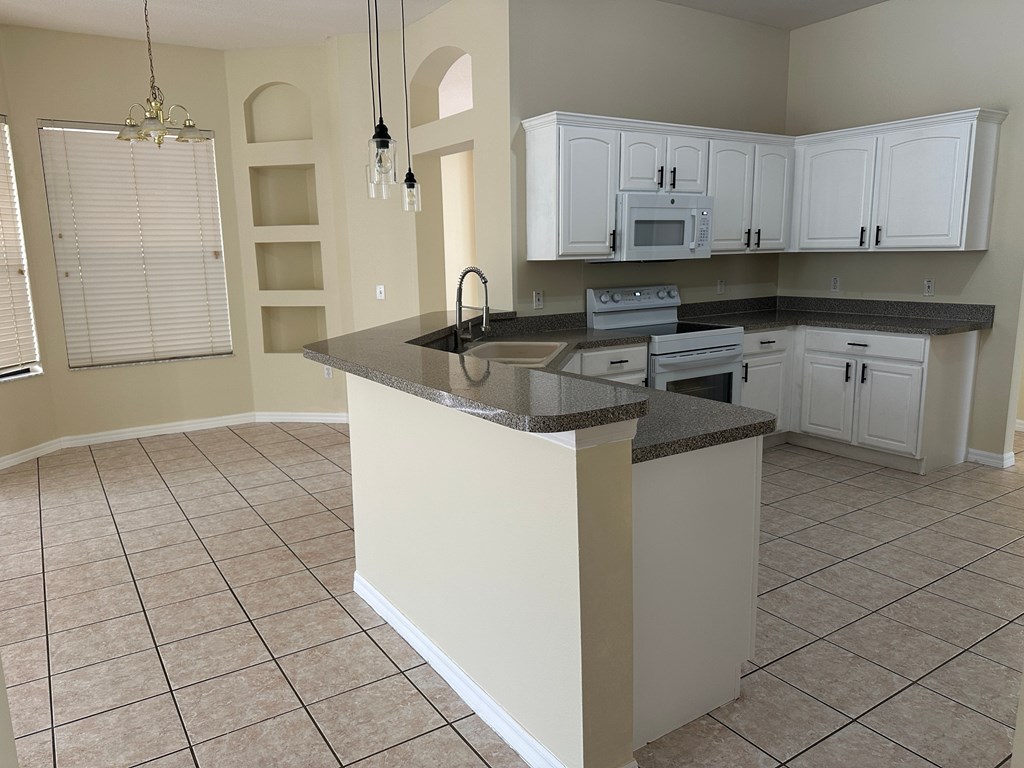 A kitchen with a counter and cabinets.