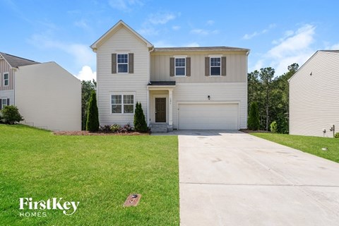A house with a garage is for sale by FirstKey Homes.