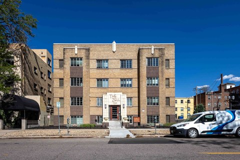 A building with a sign that says "The Cellar" on it.