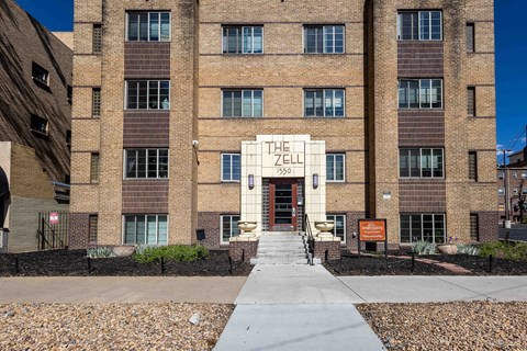 The Zell building is a large brick structure with a stone walkway leading to the entrance.