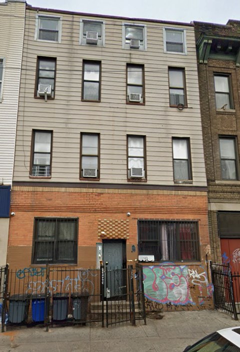 A building with a fence in front of it.