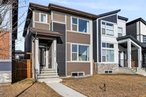 A modern two-story house with a front porch.
