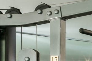 A spacious gym with a variety of equipment including treadmills, stationary bikes, and weight machines.