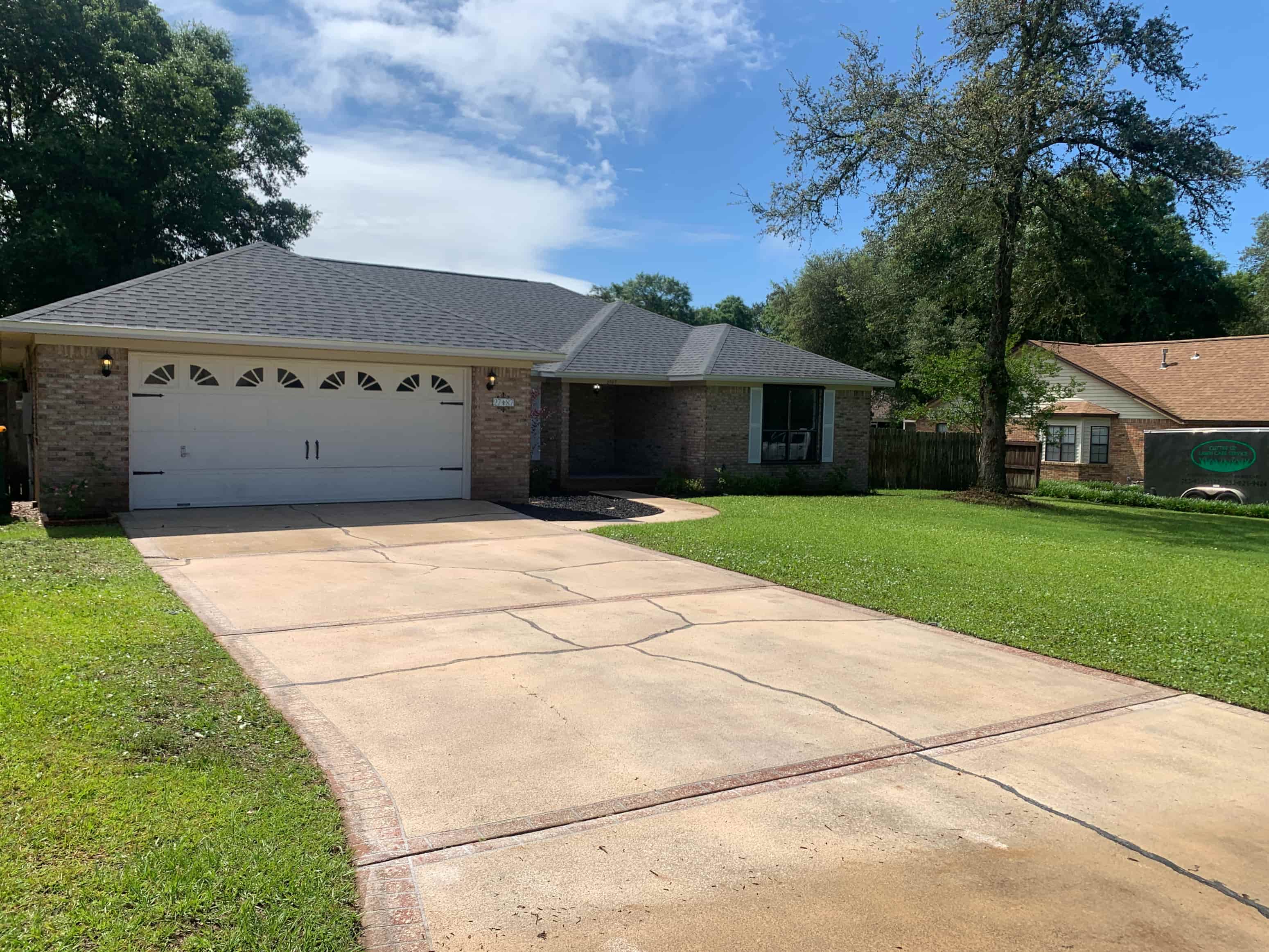 A house with a driveway in front of it.