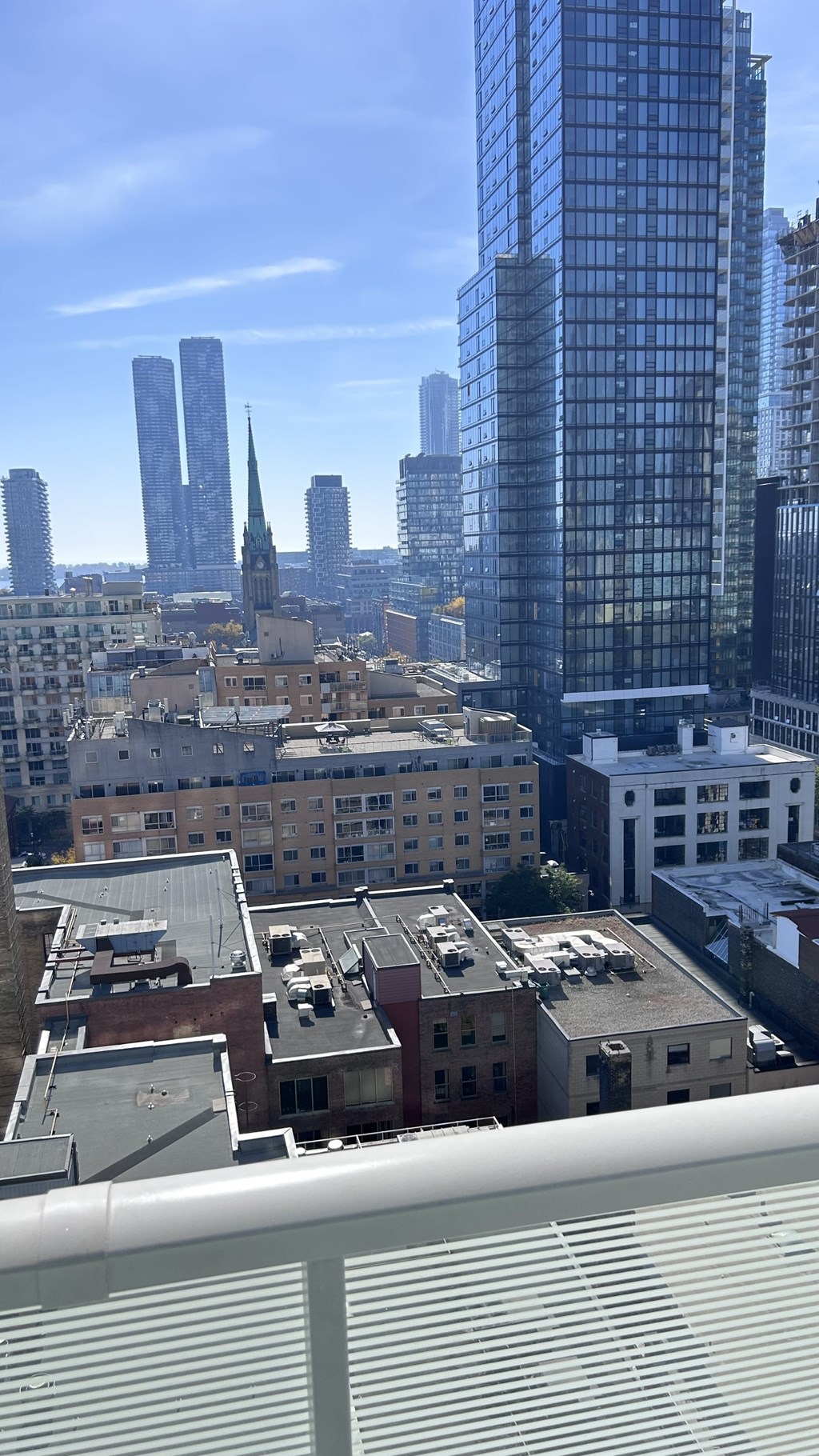 A cityscape with a mix of modern and older buildings.
