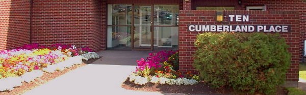 The entrance to a building with a sign that says Cumberland Place.
