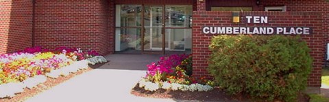 The entrance to a building with a sign that says Cumberland Place.