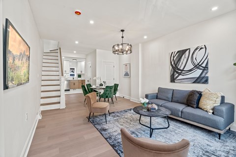 A living room with a grey couch and a coffee table.