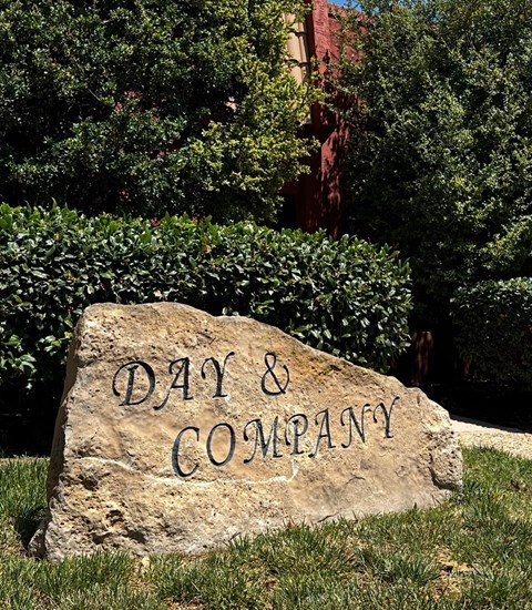 A stone with the words "Day & Company" carved into it.
