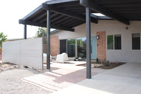 A house with a covered patio area.