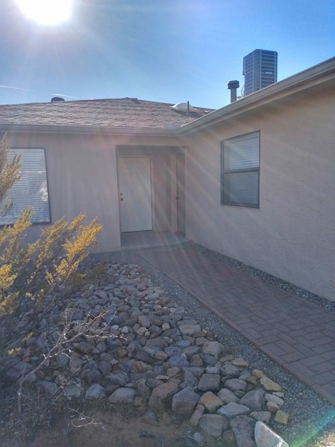 A house with a brown roof and a brown door.