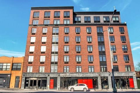 A red brick building with a sign that says "EMS Special Services Day Habilitation.".