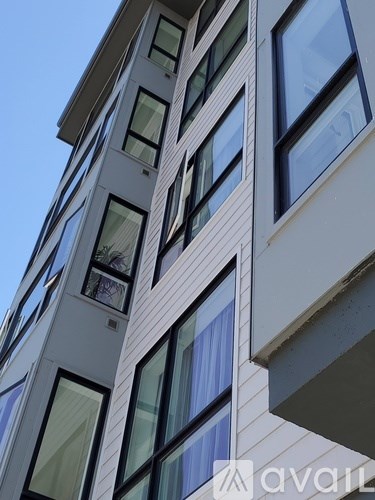 A tall building with many windows and balconies.