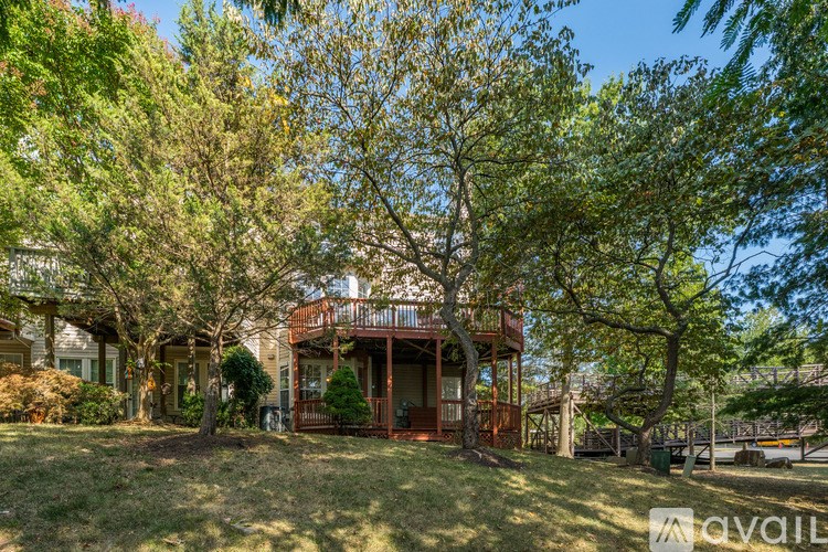 A street view of a residential area with houses on the right and a street name "Bull Run" on the road.