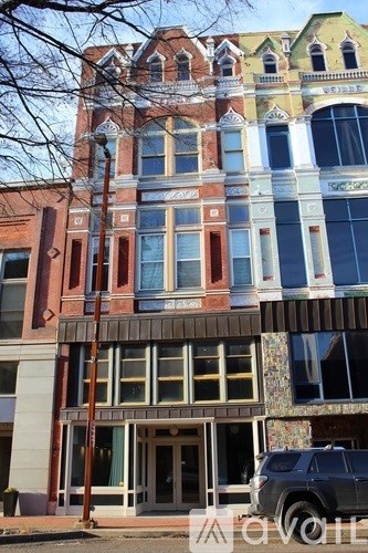 A multi-story building with a mix of red, yellow, and blue colors.
