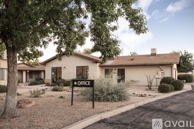 A house with a sign that says "OFFICE" in front of it.