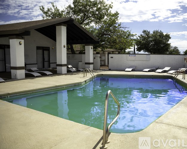 A pool with a metal ladder in the middle of it.