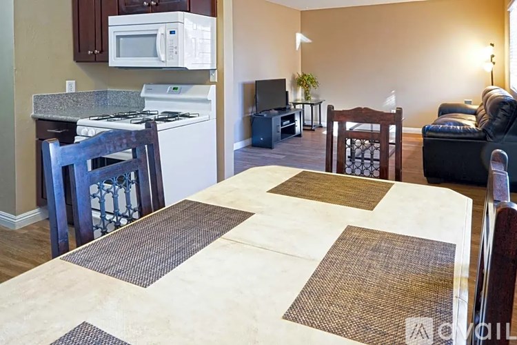 A kitchen with a microwave and stove top oven.