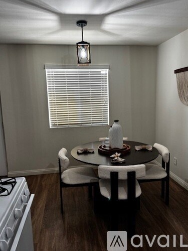A staircase with a metal railing leads up to a building.