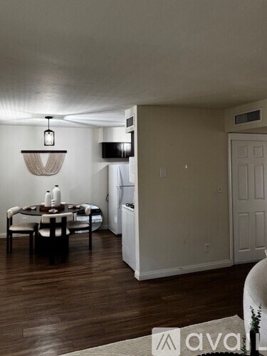 A room with a window and a filing cabinet.