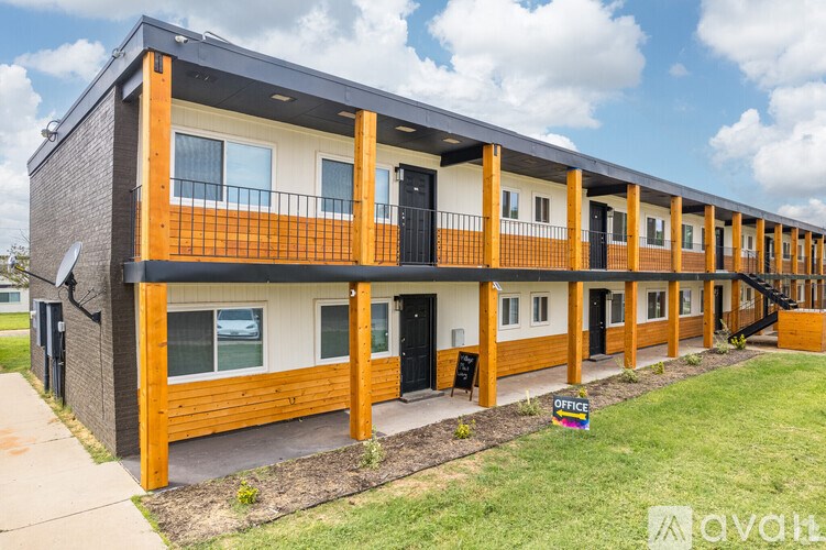 A long building with a sign that says "Office" on it.