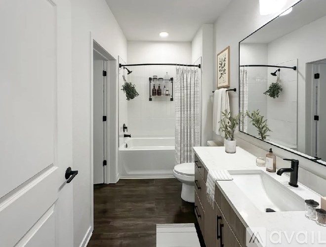 A bathroom with a white toilet and a white sink.