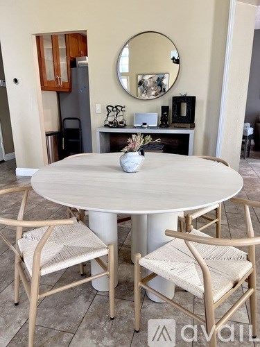 A bowl of cheese, crackers, and grapes.