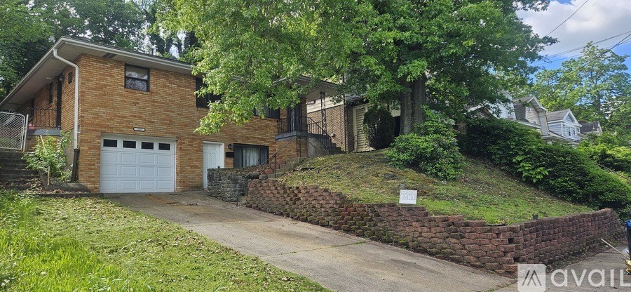 A grey metal box with a yellow sticker on it is in a room.