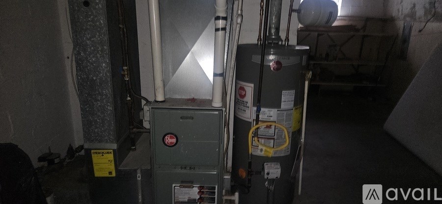 A grey metal box with a yellow sticker on it is in a room.