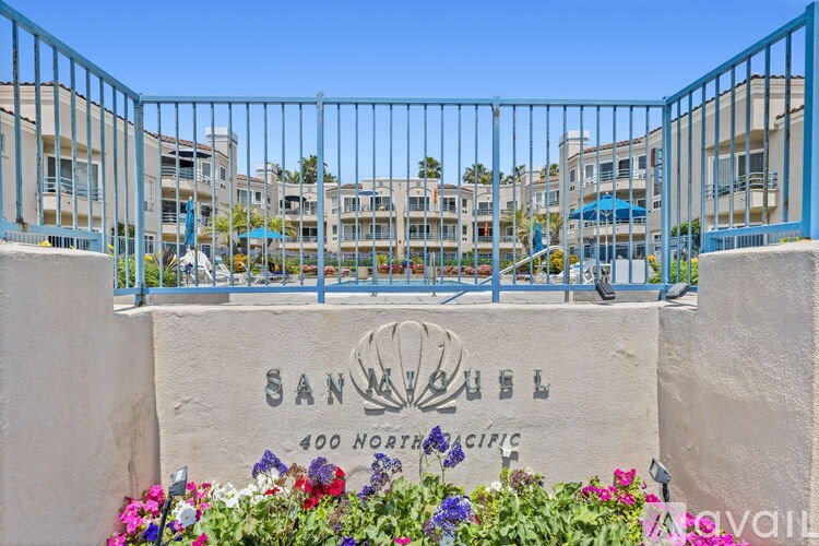 A sign that says Sanibel in front of a building.