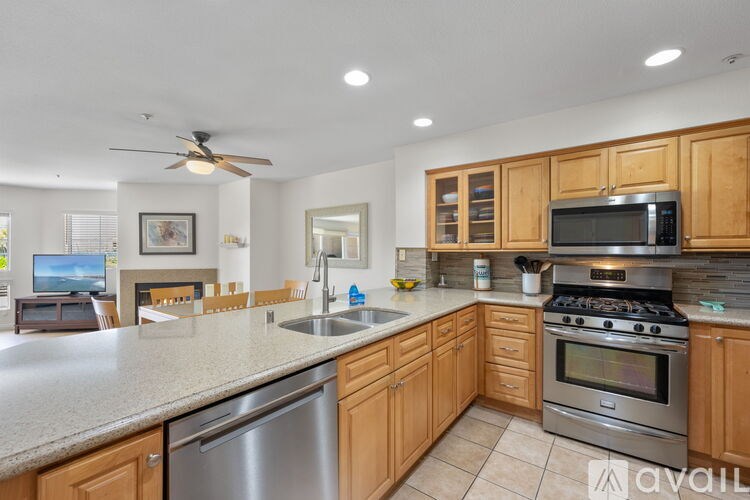 A bedroom with two beds and a ceiling fan.