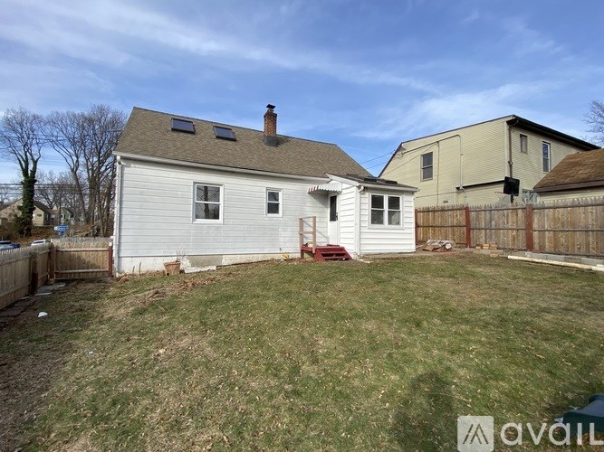 A house with a fence and a yard.