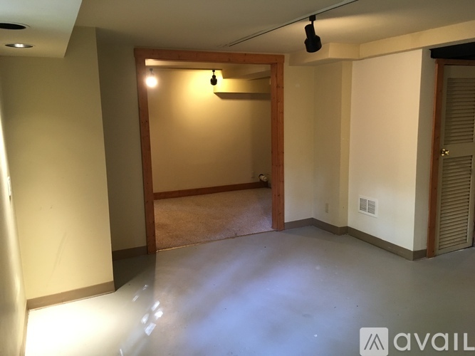 A room with a doorway leading to another room.