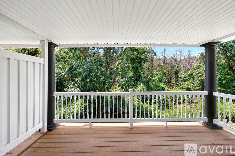 A living room with a television, a couch, and a coffee table.