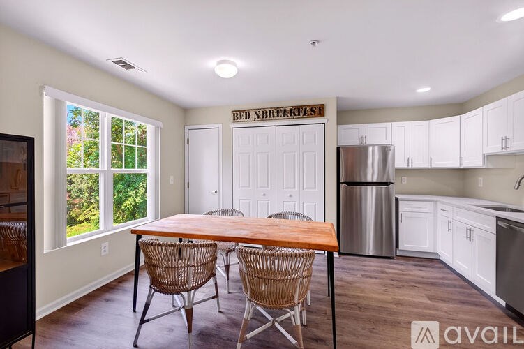 A kitchen with a breakfast sign on the wall.