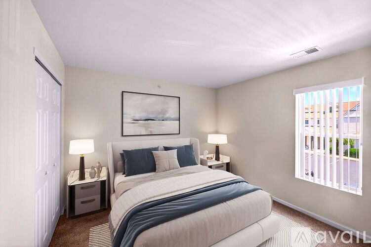 A bedroom with a large bed and a painting on the wall.