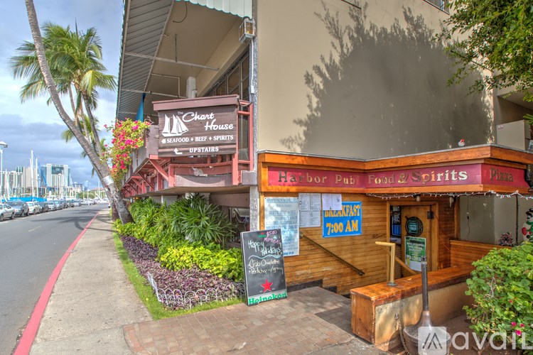 A restaurant named Chanty House is located on a street with a red sidewalk.