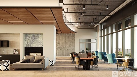 A modern living room with a fireplace and a dining area.