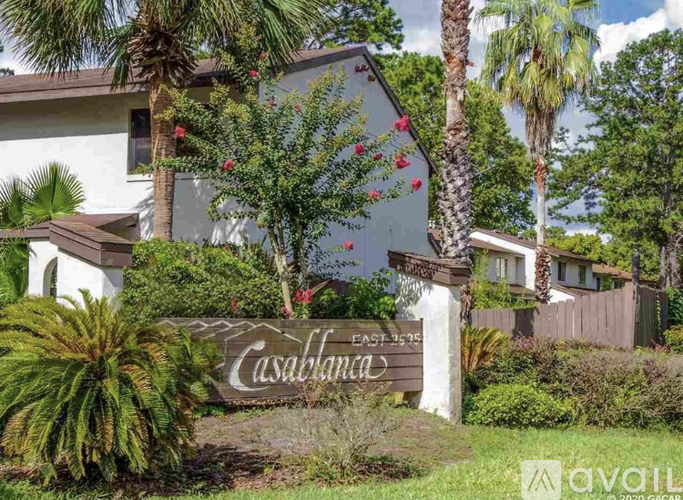 A sign in front of a house that says "Casablanca" and "East 375".