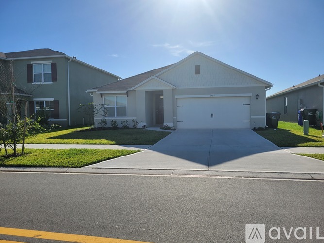 A house with a garage is available for sale.