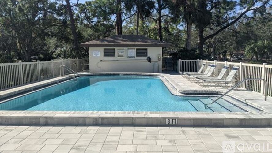 A pool with a small building next to it.