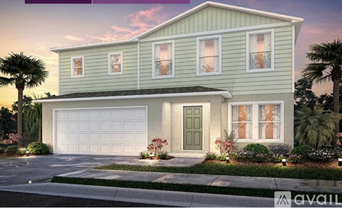 A two-story house with a garage and a front yard.