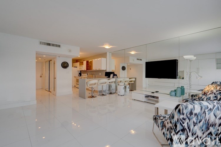 A modern living room with a leopard print sofa.