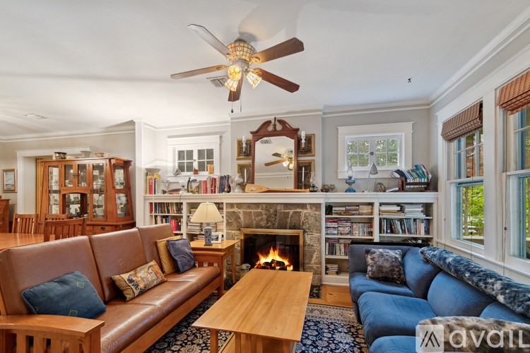 A living room with a fireplace and a couch.