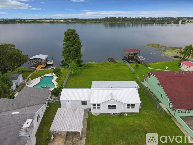 A house with a swimming pool is for sale.