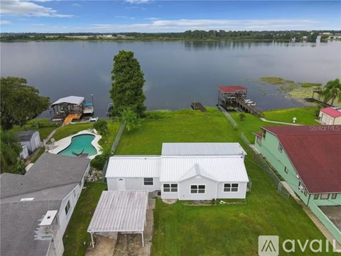 A house with a swimming pool is for sale.